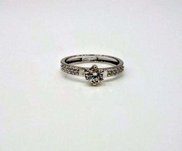 ANILLO SOLITARIO GARRA 6 PUNTAS ORO BLANCO 18KT